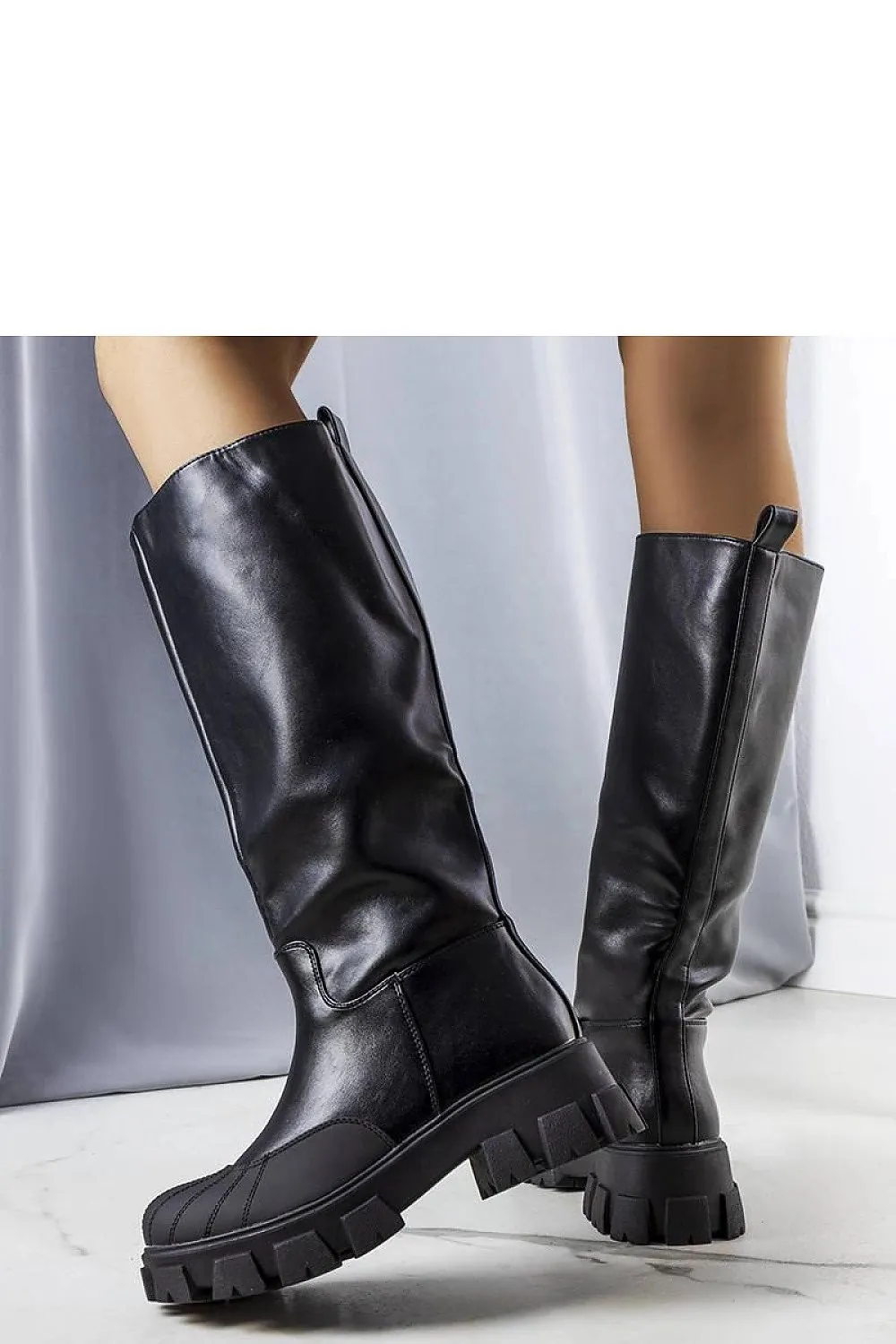 Black boots with a thick sole leather